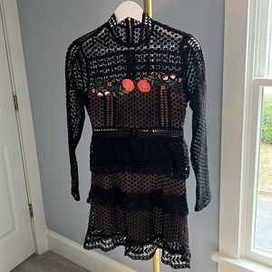 Black cutout dress, tiered skirt and long sleeves. Purchased in Italy!